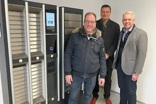 Bild von drei Personen